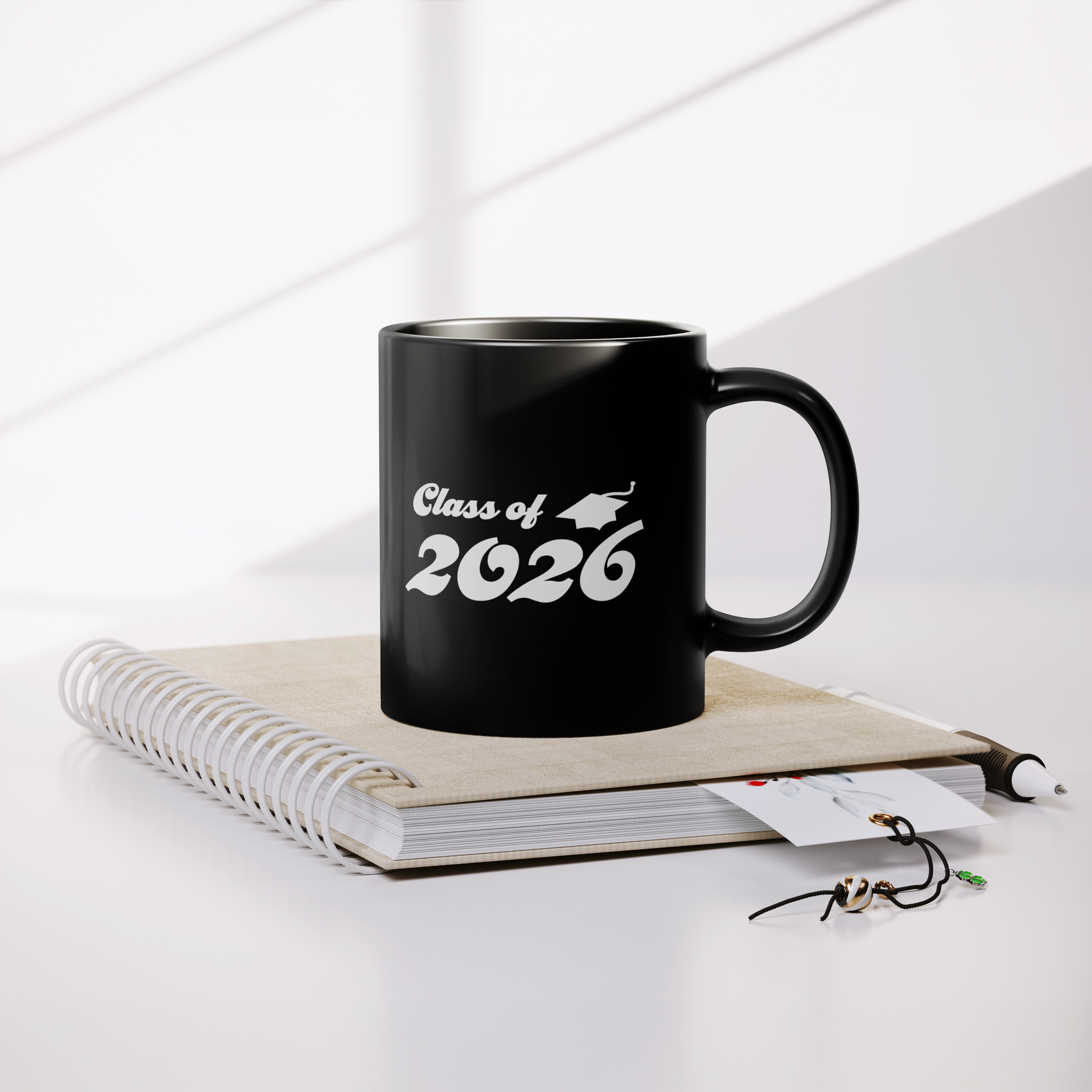 Class_of_2026_11oz_Mug_-_Black_Lifestyle_Notebook_Mockup.png